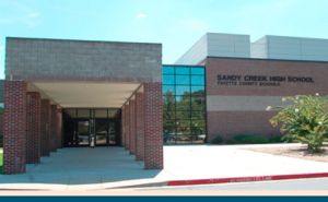 news_stock-art_04-09-15_Sandy-Creek-High-School-entrance