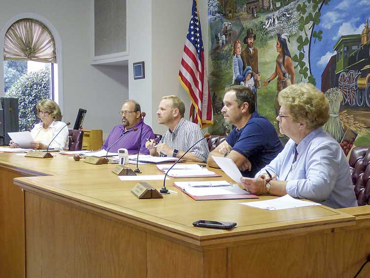 The Tyrone town Council on July 20 unanimously approved the development plan and rezoning for Founders Studios on Ga. Highway 74. Pictured, from left, are council members Gloria Furr and Ken Matthews, Mayor Eric Dial, and council members Ryan Housley and Linda Howard. Photo/Ben Nelms.