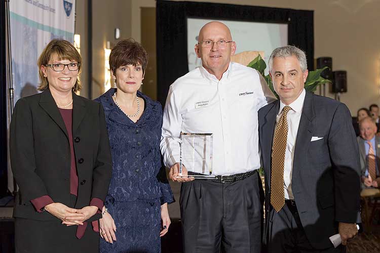 Small Business of the Year is CMIT Solutions of Fayette/Coweta. Above, Chamber CEO Carlotta Ungaro, outgoing chair Kim Schnoes, CMIT’s Doug Bates and Christian City CEO Len Romano. Photo/Roger Sibaja, Gobi Photography.