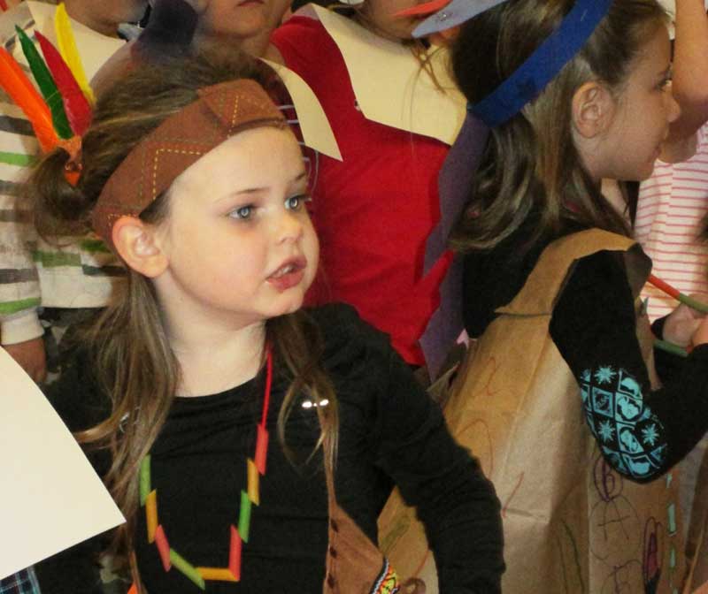Kindergartners from Huddleston Elementary School dress as pilgrims and Native Americans for their class’ reenactment of the first Thanksgiving feast. Student Jessica Felker dances dressed in Native American garb. Photos/ Submitted.