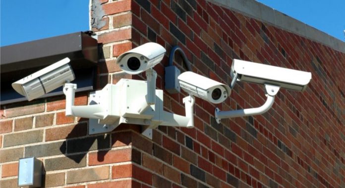 Stock photo of array of school surveillance cameras.