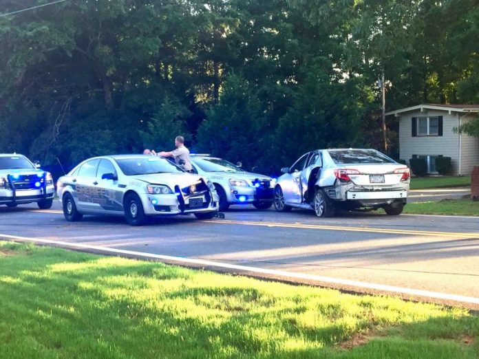 Fayette County deputies investigate the aftermath of a high speed chase that began in Riverdale and ended in north Fayette. Photo/Steve Stanley.