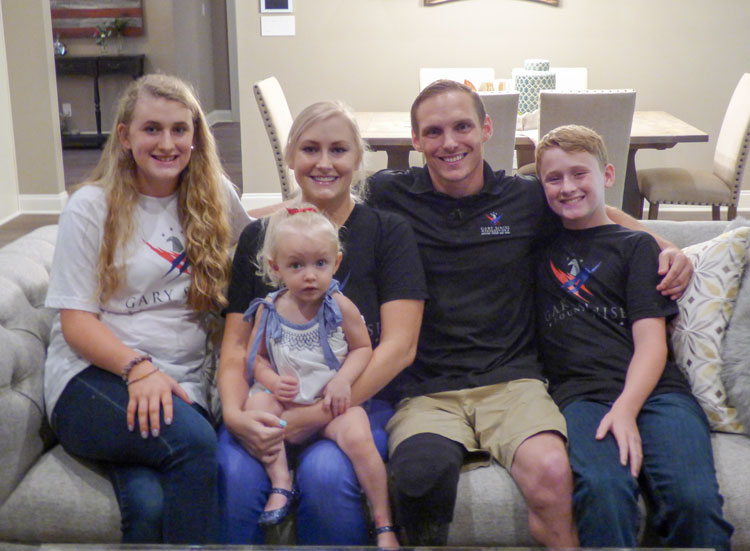 The Hunter family has moved into their new home outside Fayetteville, funded and constructed by the Gary Sinise Foundation. Pictured, from left, are 13-year-old Kensley, mom Kenna, dad Eric, 11-year-old Jayce and, in front, 19-month-old Adley. Photo/Ben Nelms.
