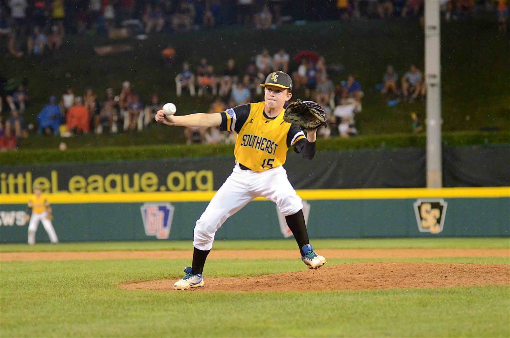 Peachtree City Little League’s Connor Riggs-Soper fields a ground ball from the pitcher’s mound during a Little League World Series game. Photo/Brett R. Crossley.