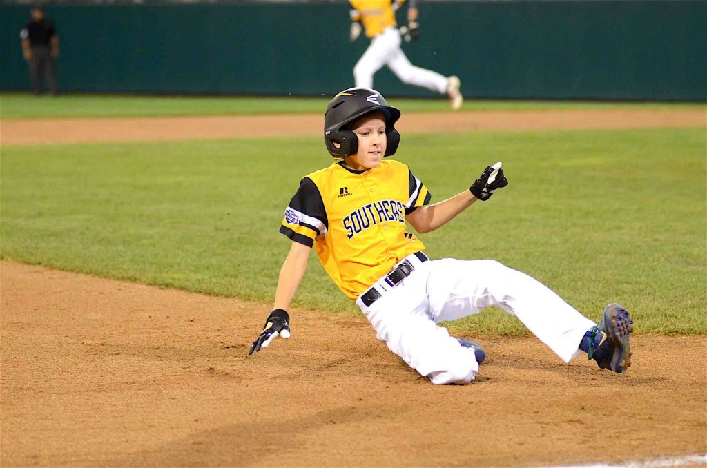 Peachtree City’s Ben Traxler slides into third after a wild pitch during a Little League World Series game in Williamsport, PA. Photo/Brett R. Crossley.