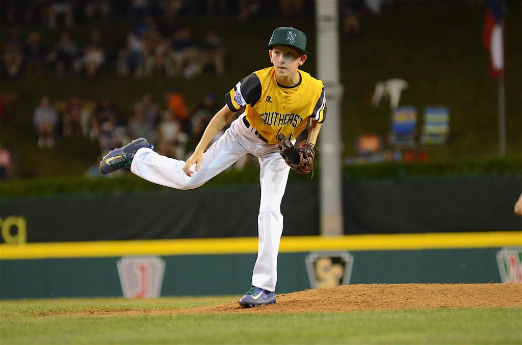 Peachtree City’s Ben Traxler tosses a pitch during an extra innings of a Little League World Series game in Williamsport, PA. Traxler pitched all three extra innings along with hitting a game-winning sacrifice fly to right field. Photo/Brett R. Crossley.