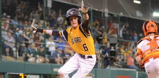 Peachtree City’s Wills Maginnis jumps up from home after scoring the game-winning run of a Little League World Series game against the Southwest. Photo/Brett R. Crossley.