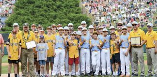 Competitors become friends — It’s a mixture of the world’s best Sunday, as members and coaches of the Peachtree City American Little League team (in yellow jersies) mingle with the World Series winner Hawaii after both teams received an unprecedented honor: A joint sportsmanship award. Photo/Brett R. Crossley.