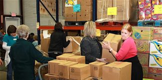 Volunteers work in the warehouse at Midwest Food Bank in Peachtree City. Photo/Midwest Food Bank.