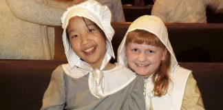 Crossroads Christian School fifth-grade students Hannah Cooke and Katie Ferrell take a moment after their school’s Thanksgiving play Nov. 15. Every student performed in “The First Thanksgiving,” which commemorates the Pilgrims’ quest for religious freedom, God’s provision, and the friendship of Native Americans to the newcomers. Photo/Submitted.