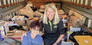 Kathy Gloer and friend Sandi Donaldson help to load a trailer full of relief supplies for hurricane victims in the Florida panhandle. Photo/Hearts with Hope Facebook page.