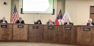 Members of the Peachtree City Council listen to Councilman Terry Ernst (3rd from right) explain his vote against a trash pickup proposal. Also shown are (L-R) City Manager Jon Rorie, Councilman Mike King, Mayor Vanessa Fleisch, Ernst, Councilman Kevin Madden and Councilman Phil Prebor. Photo/Cal Beverly.