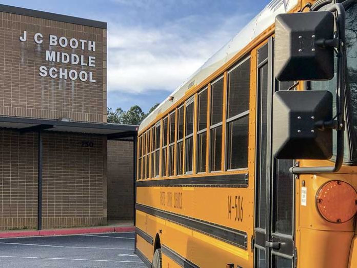 School bus parked at the current Booth Middle School. File Photo.