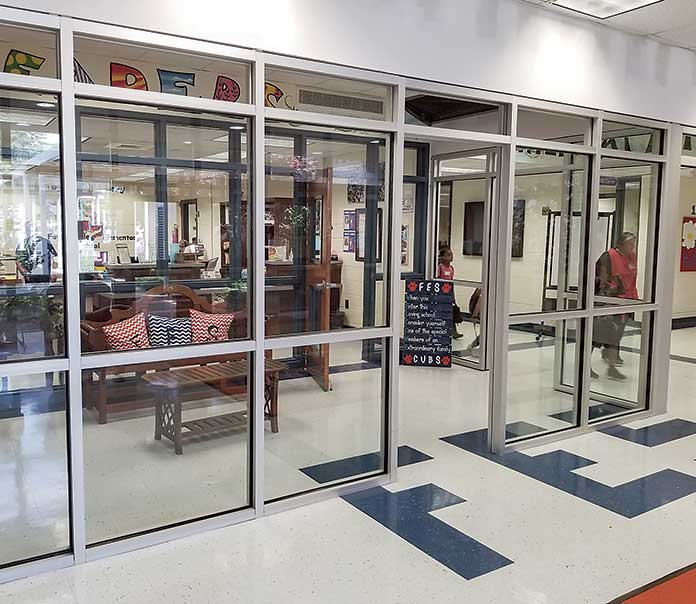 Parents and students entering Fayetteville Elementary School this summer will see a modified entranceway. Below that photo, a new security vestibule is in place for the opening of Flat Rock Middle School. Photos/Fayette County School System.