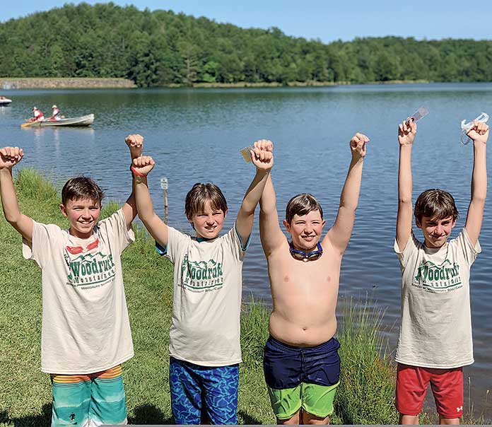 These members of Boy Scout Troop 75 earned Mile Swim Awards this summer. Pictured, from left, are Luke Hofrichter, Max Nolen, Jake Harper, and Jack Lynch. Photo/Submitted.