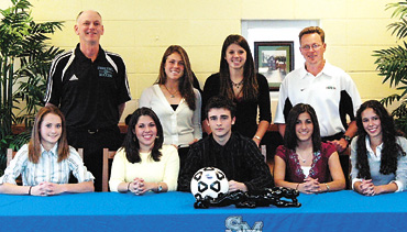 Kelley O’Hara signs her letter of intent to attend Stanford University, from The Citizen, February 2006 — Starr’s Mill High School had seven soccer players sign letters of intent on Wednesday afternoon. The Lady Panthers had six players sign scholarships. Adrienne Phillips and Jamie Daley both signed with West Georgia, while Tannah Castro signed with Furman University, Sarah Capati signed with Berry, Katie Jacobsen signed with the University of Georgia and Kelley O’Hara signed with Stanford University. On the boys side, Riley Phelps signed with Coastal Carolina University. In the front row, from left, are Adrienne Phillips, Tannah Castro, Riley Phelps, Jamie Daley and Sarah Capati. In the back row are Starr’s Mill Lady Panthers head coach Greg Shifflett, Kelley O'Hara, Katie Jacobsen and 88 PTC Lazers Coach Brian Moore. Photo/Special.