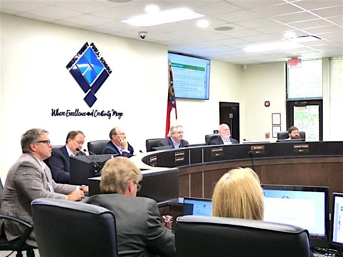 Seated at the dais at the Sept. 9 meeting of the Fayette County Board of Education were, from left, board members Brian Anderson and Barry Marchman, Superintendent Jody Barrow, Chairman Scott Hollowell and board members Roy Rabold and Leonard Presberg. Photo/Ben Nelms.