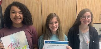 2020 Legend editors Jaylen Smith (12), with a copy of the 2019 book; Rachel Edge (12), holding the NSPA award; and Natalie Spellman (10). Photo by Landon Wilde.