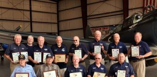 Three CAF Dixie Wing members honored this month for more than 50 years each of service as pilots and mechanics were joined by 10 previous winners from the Dixie Wing. The entire group gathered at the Dixie Wing Warbird Museum to show the depth of experience within the Dixie Wing membership. From left, back row are: Tony Stein, John Flynn, Jim Buckley, Charles Kennedy, Elmer Koldoff, Ric Carlson, Willard Womack and Andy Anderson. Front row, from left, are: Willie Dickerson, Bill Baldwin, Ron Gause, George Harrison and Ray "Pop" Wilson. Photo/Charles Burcher.