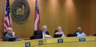 Fayette County commissioners hearing a rezoning request on Oct. 24 included, from left, Commissioner Edge Gibbons, Chairman Randy Ognio and commissioners Chuck Oddo and Charles Rousseau. Photo/Ben Nelms.