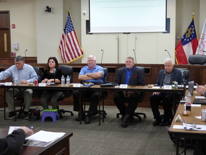 The Peachtree City Council on Dec. 3 held an informal meeting to talk about potential future goals. Pictured, from left, are, Councilman Mike King, Mayor Vanessa Fleisch and councilmen Terry Ernst, Kevin Madden and Phil Prebor. Photo/Ben Nelms.