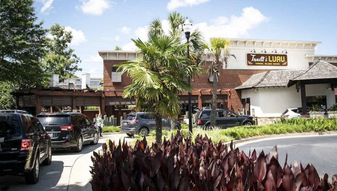 Thanks to a recent social media post, a mass of people wait to sample the fare at Truett's Luau restaurant in Fayetteville. Photo/Michael Clifton — KombatKamera.com.