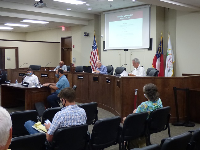 <b>Peachtree City Planning Commission members at the Sept. 14 meeting included, from left on the floor, commissioners Kenneth Hamner and Scott Ritenour and, at the dais from left, Commissioner Michael Link, Chairman Frank Destadio and Commissioner Paul Gresham. Photo/Ben Nelms. </b>