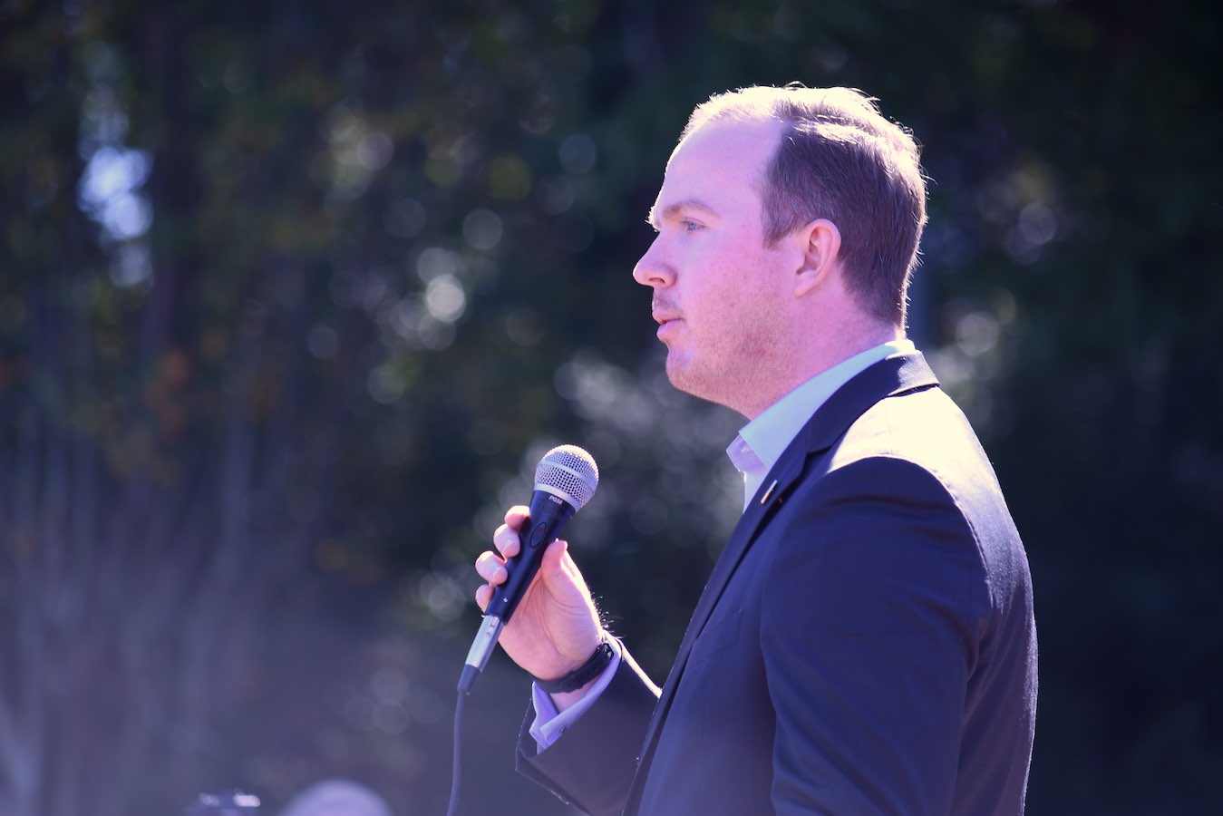 <b>White House political aide Brian Jack, a Fayette native, warms up the crowd at Saturday's rally for President Trump. Photo/Cal Beverly.</b>