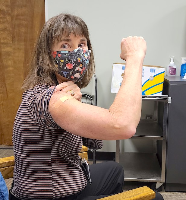 <b>Fayette County Public Schools Health Services Coordinator Debbie King proudly displays her bandage after becoming the first nurse and employee in the school system to receive the Moderna Covid-19 vaccine. Photo/Fayette School System.</b>