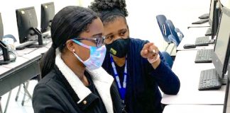 Teacher Melissa Turnipseed (right) helps student Ariana Samuels during an AP Computer Science Principles class at Sandy Creek High School.