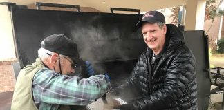 Pit masters Joe Williams and Dr. Bryan Woods hard at work. Photo/Submitted.