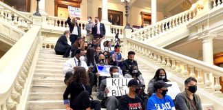 Voting-rights advocates protest inside the state Capitol against Senate Majority Leader Mike Dugan’s (R-Carrollton) elections bill before its passage in the Georgia Senate on March 8, 2021. Photo/Beau Evans.