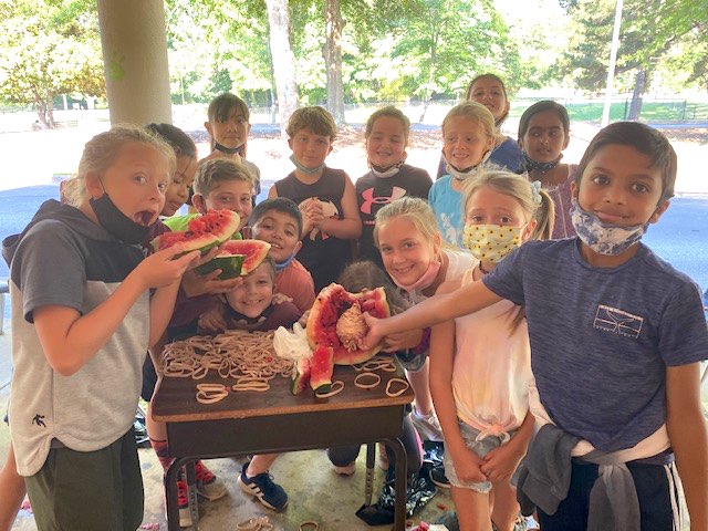 <b>Students "clean up" the remains of their fruitful and tasty watermelon science experiment Photo/Fayette County School System.</b>