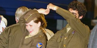 WWII Reenactors from a previous Hangar Dance enjoy the swing music and 1940s atmosphere of CAF Airbase Georgia's annual event, which returns Sept. 25 at Falcon Field in Peachtree City. The dance honors the memory of the Greatest Generation and supports Airbase Georgia's aircraft restoration programs. Photo/Pam Ellis.