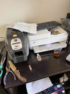 Some of the equipment used to produce fake identity cards. Photo/Peachtree City Police Department.