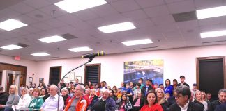 Crowd awaits action by the Peachtree City Council. Photo/Cal Beverly.