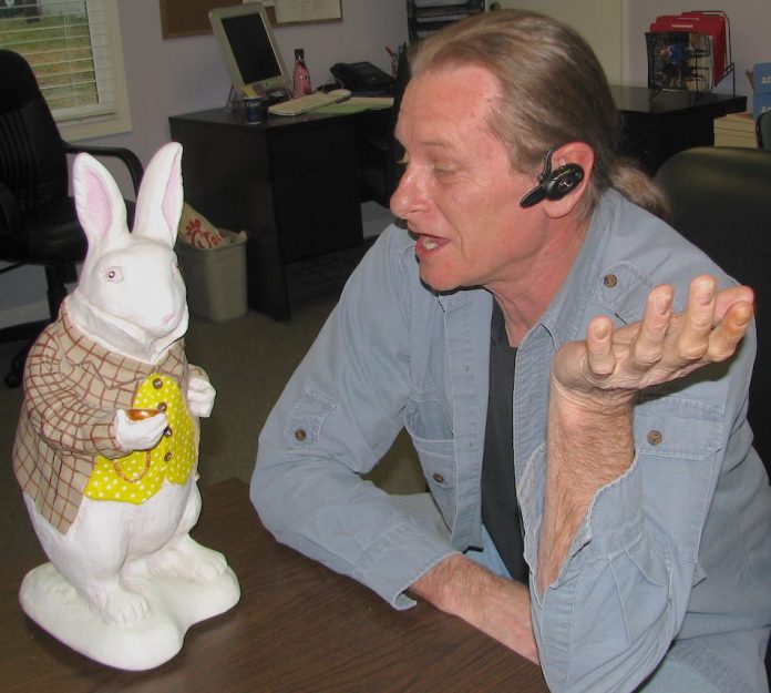 The Citizen's Ben Nelms in conversation with his ubiquitous White Rabbit, which was known to have accompanied him several times as he covered local events and government meetings.