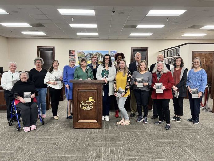 Authors, poets and contributors to the Peachtree City Library anthology ”Hip Pocket” pose for a group photo at the March 16, 2023 Peachtree City Council meeting. Photo/Submitted.