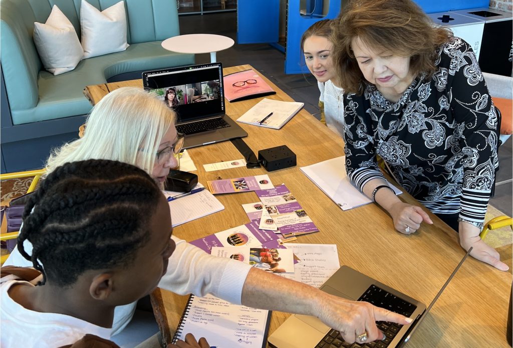 Enthusiastic branding project kick-off for the Women at the WELL ministry. (LR) Zavion Green, Debbie Gronner, Janine Baggett (via Zoom), Mia Scarbrough, and Marta Fewell. April 11, 2024 at Trilith. Photo/Joe Domaleski