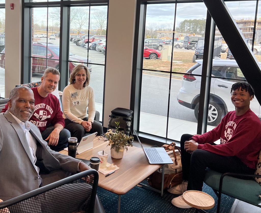 Fayette Chamber CEO Leonardo McClarty, CFC Owner Joe Domaleski, Fayette Schools WBL Coordinator Melanie Duncan, and CFC Intern (and recent SCHS Graduate) Zavion Green meet at Trilith to discuss the internship program in early 2024. Photo/Trey Strawn