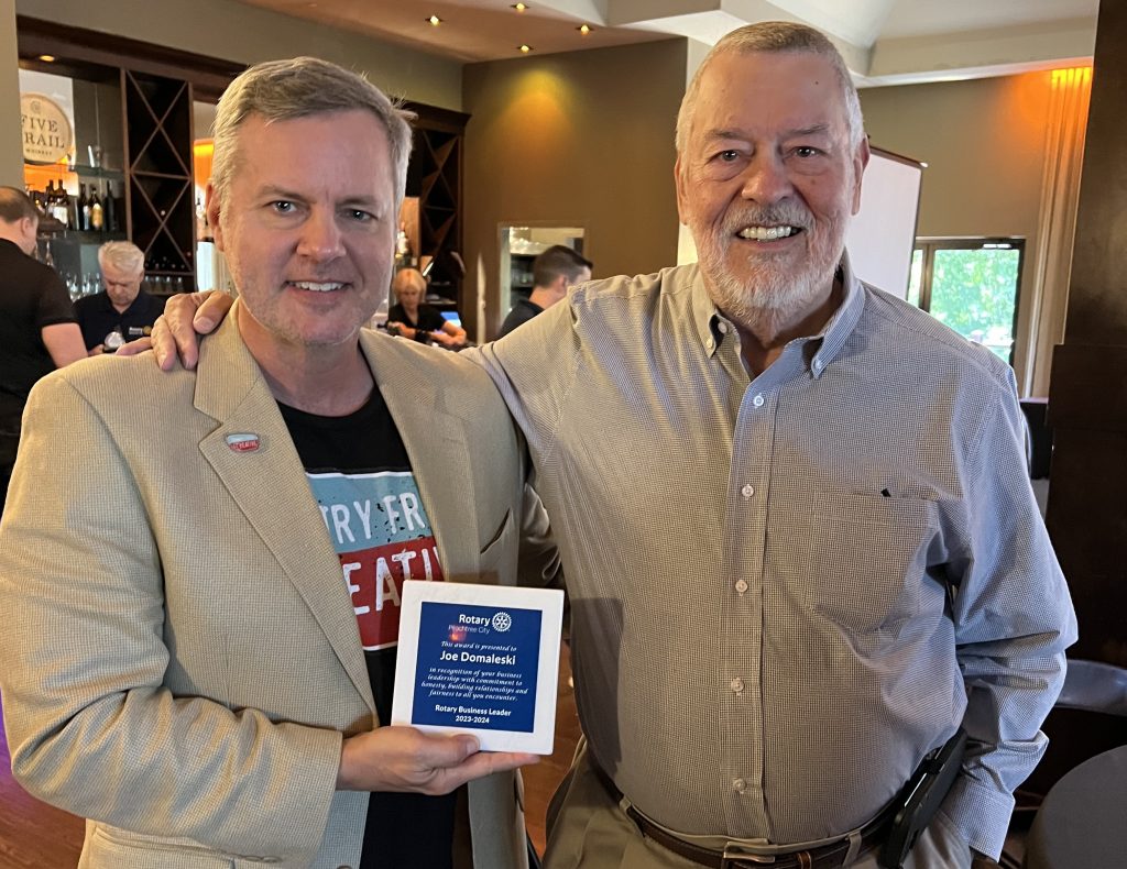 Joe Domaleski with Cal Beverly during a meeting of the Peachtree City Rotary Club. Photo/Ellie White-Stevens