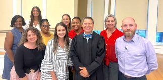 Fayette State Court Judge Jason Thompson (center in black robe) and the DUI Court team observe National Recovery Month during September. Photo/Submitted.