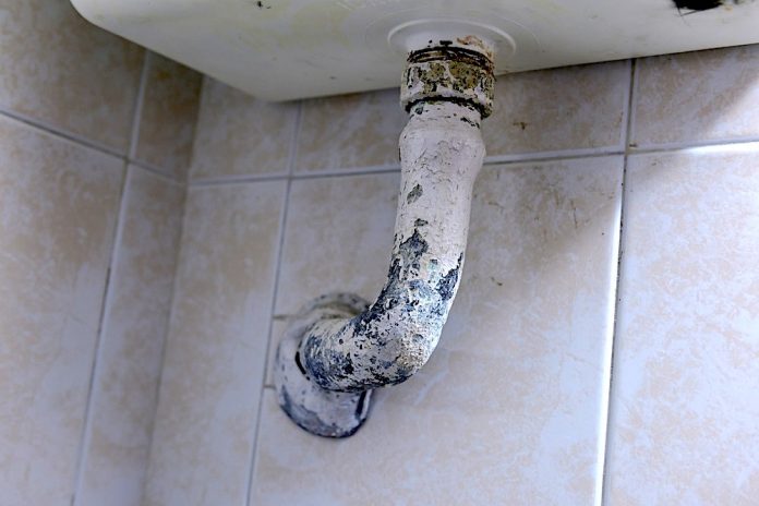 Lead pipe below a wash basin. Photo/Shutterstock.