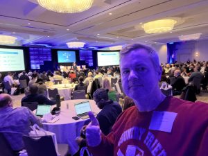 Learning and networking with other AI professionals at a conference in Atlanta. Photo/Joe Domaleski