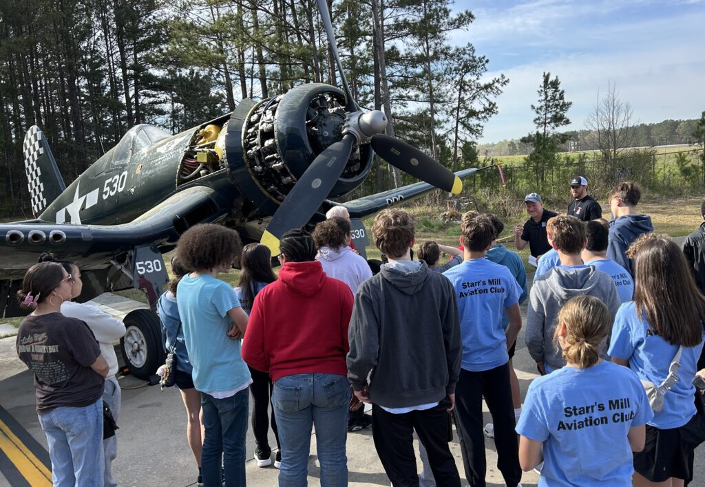 Starr’s Mill HS Aviation Club interacts with history at Airbase Georgia in Peachtree City.