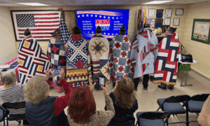 Quilts of Valor honors eight local veterans with...
