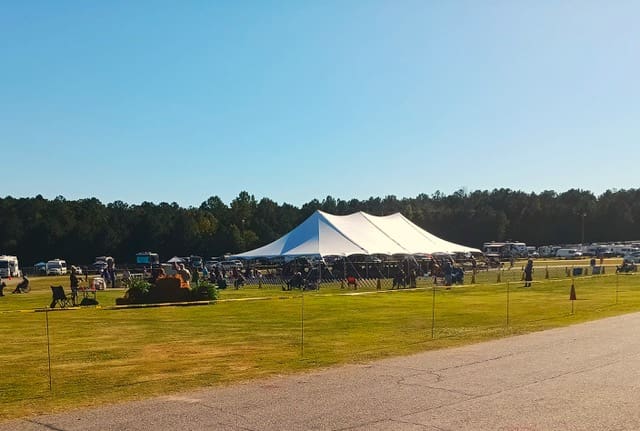 Tents and spectators on the grounds of the Coweta County Fairgrounds during the dog show.
