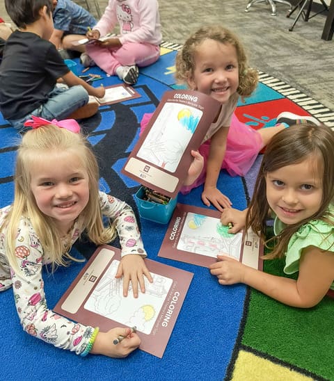 Inman Elementary students coloring Fox Theatre workbooks