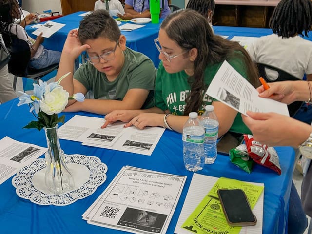 A Burch Elementary student works on a literacy activity at the Literacy Cafe