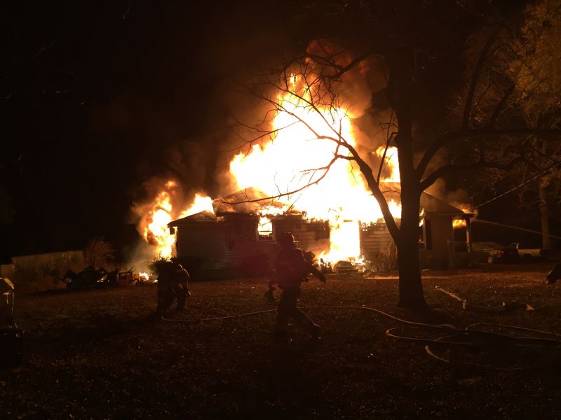Home destroyed in fire, residents safe